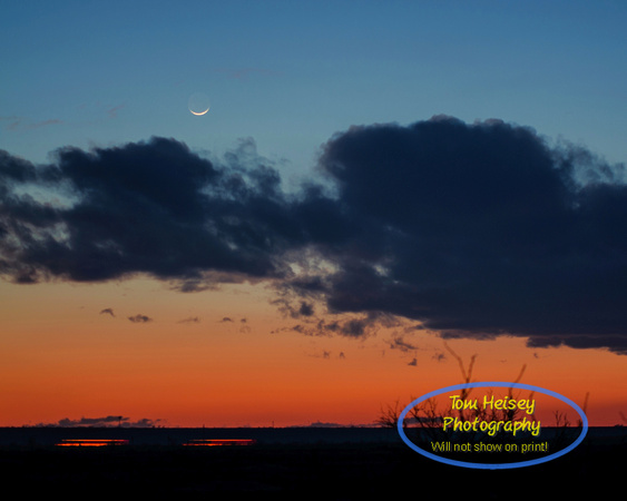 Crescent Moon sunset over the prairie